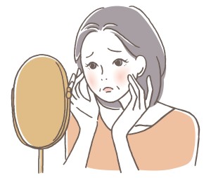 鏡を見ている女性